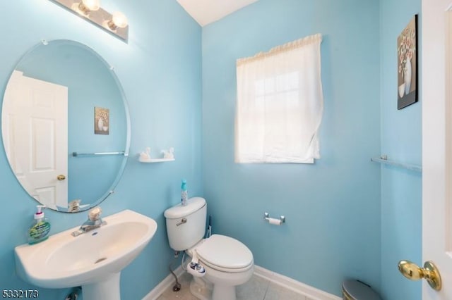 bathroom with tile patterned floors, toilet, and sink