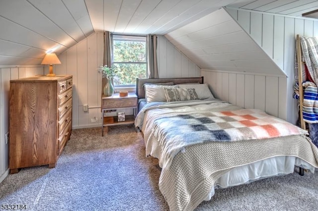 bedroom with lofted ceiling and carpet