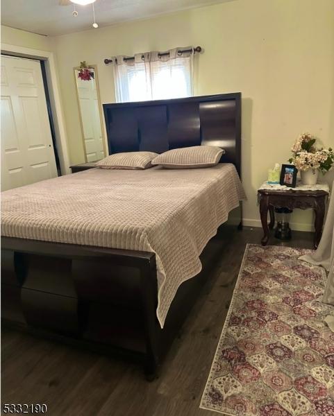 bedroom featuring dark wood-type flooring