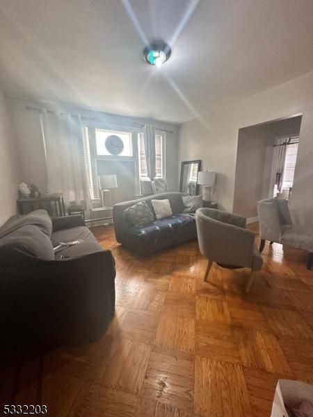 living room with parquet flooring