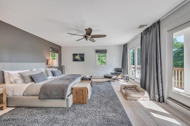 bedroom with light wood-type flooring, access to outside, and ceiling fan