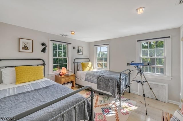 bedroom with light hardwood / wood-style flooring