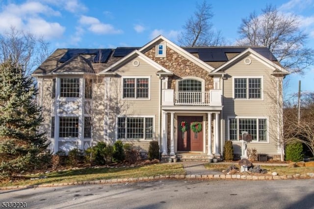 view of front of house with solar panels