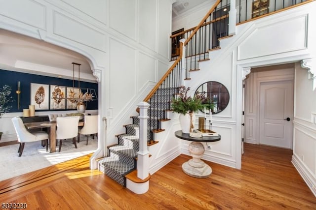 stairway with hardwood / wood-style flooring