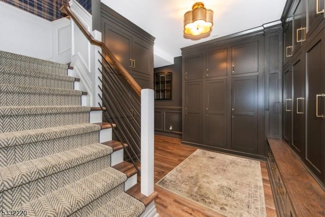 stairway featuring hardwood / wood-style flooring