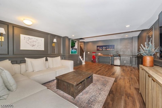 living room with dark hardwood / wood-style floors