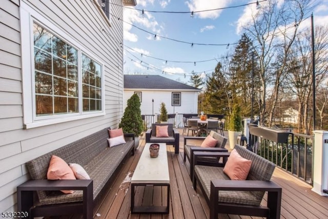 wooden deck with outdoor lounge area