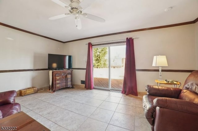 tiled living room with ceiling fan and crown molding