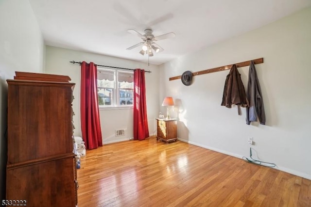 unfurnished bedroom featuring light hardwood / wood-style floors and ceiling fan