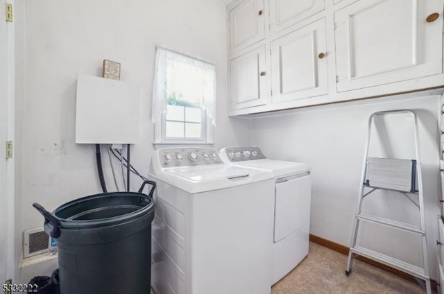 laundry area with cabinets and washing machine and dryer