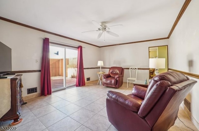 living room featuring ceiling fan, light tile patterned floors, and ornamental molding