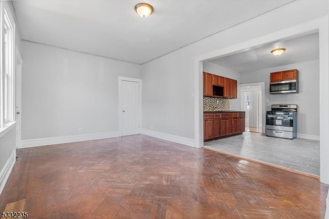 unfurnished living room with parquet floors