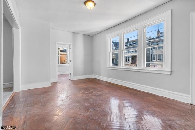 empty room with dark parquet floors