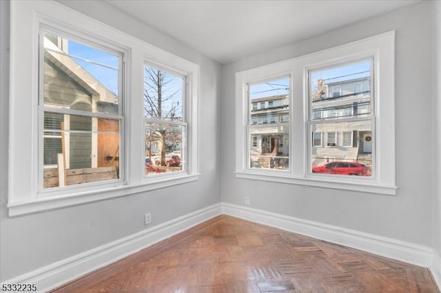 interior space featuring parquet flooring