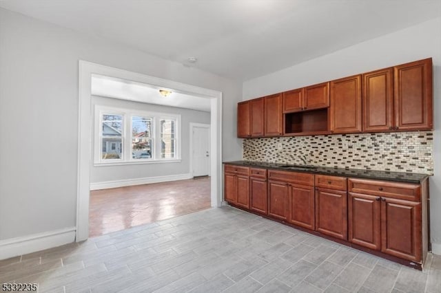 kitchen featuring light hardwood / wood-style flooring and tasteful backsplash