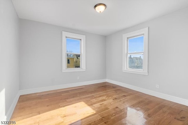 unfurnished room featuring wood-type flooring