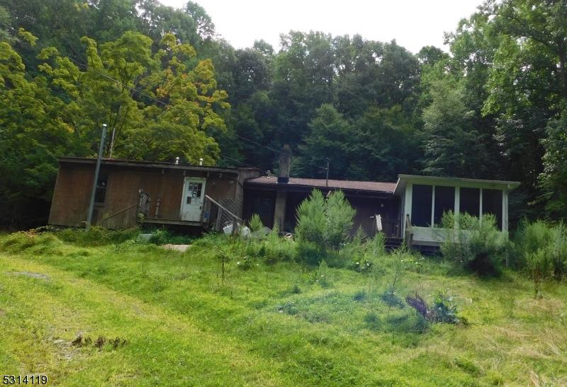 rear view of property with a sunroom