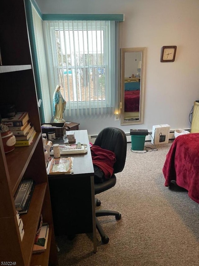 carpeted office with a baseboard heating unit