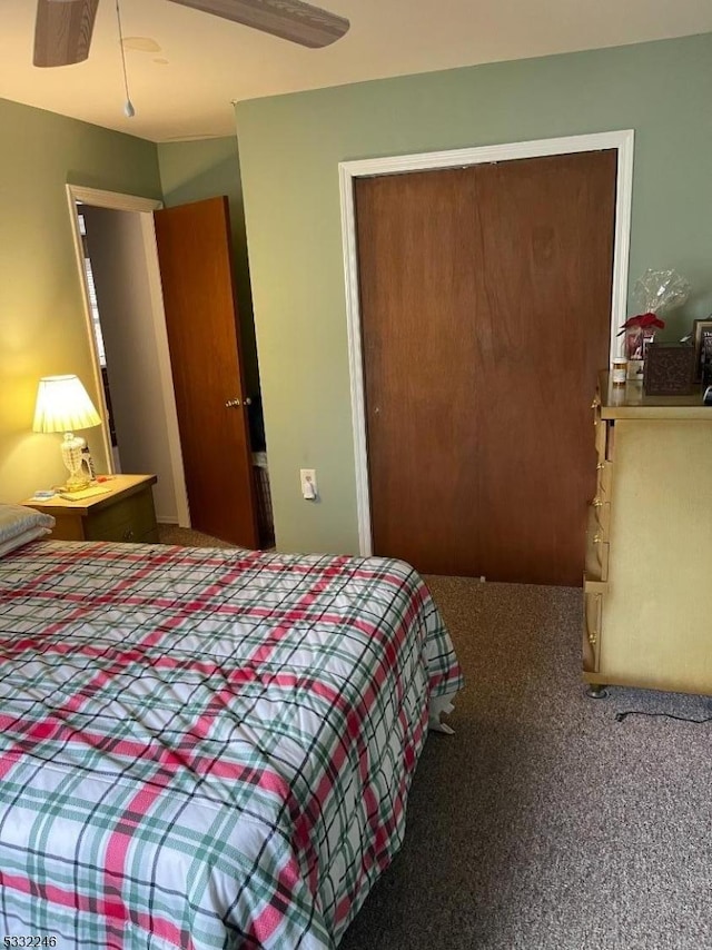 carpeted bedroom with ceiling fan