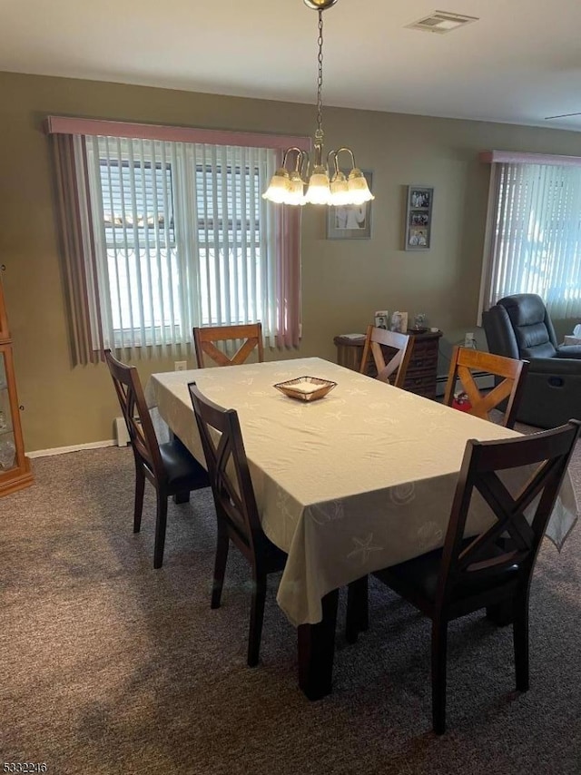 carpeted dining space with a notable chandelier