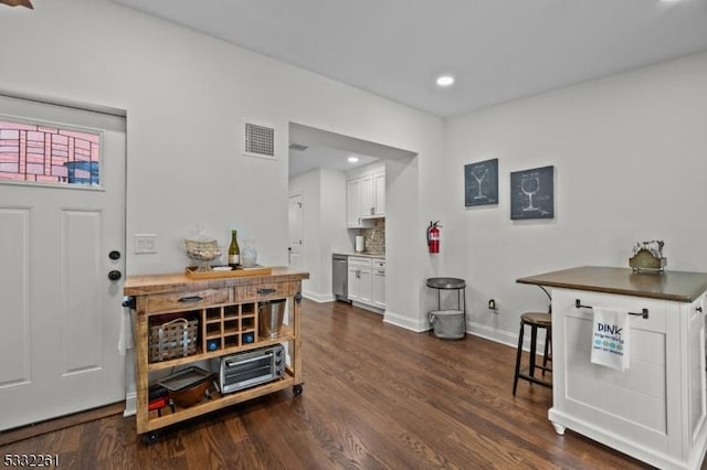 entrance foyer with dark hardwood / wood-style floors