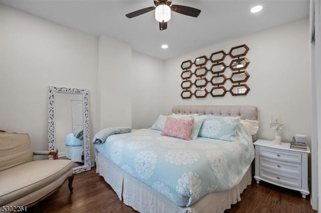 bedroom with dark wood-type flooring and ceiling fan