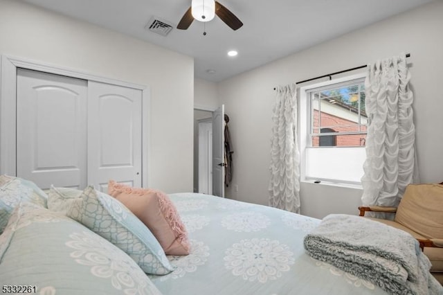 bedroom featuring ceiling fan and a closet