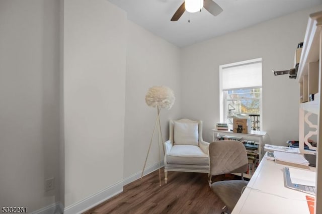 office area with dark wood-type flooring and ceiling fan