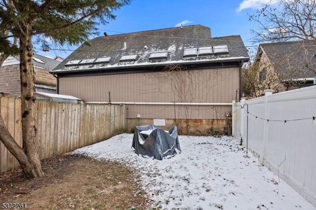 view of snow covered property