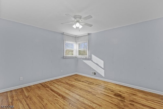 unfurnished room featuring light hardwood / wood-style flooring and ceiling fan