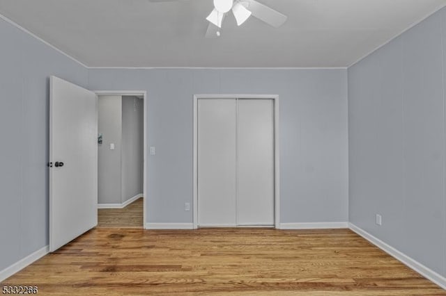 unfurnished bedroom featuring ceiling fan and light wood-type flooring