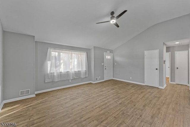 unfurnished living room with ceiling fan, light hardwood / wood-style floors, and vaulted ceiling