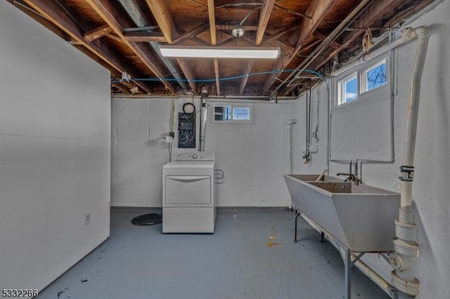 basement featuring washer / clothes dryer and sink