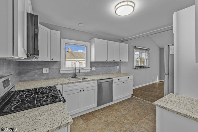 kitchen featuring white cabinets, backsplash, sink, and stainless steel appliances