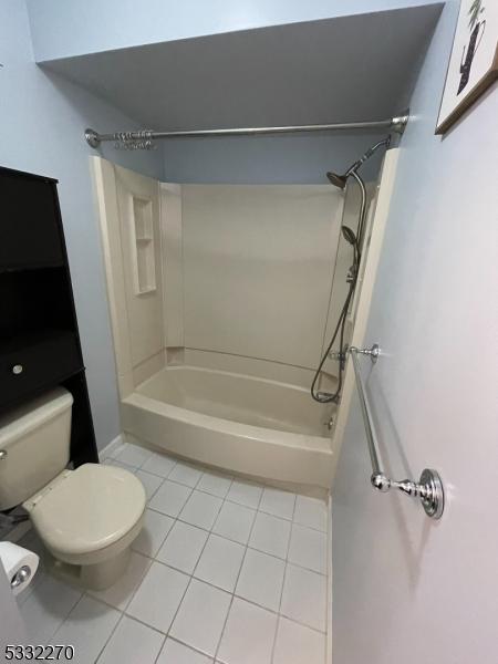 bathroom featuring tile patterned floors and toilet