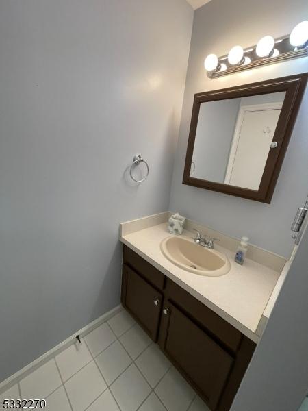 bathroom with vanity and tile patterned floors