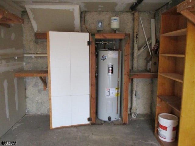 utility room with electric water heater