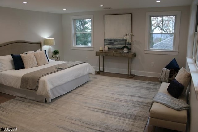 bedroom with light hardwood / wood-style flooring