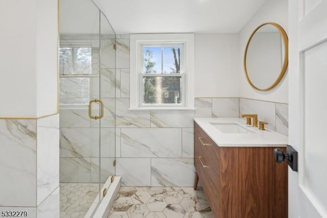 bathroom featuring vanity, tile walls, and an enclosed shower