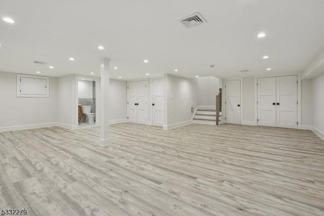 basement featuring light hardwood / wood-style flooring