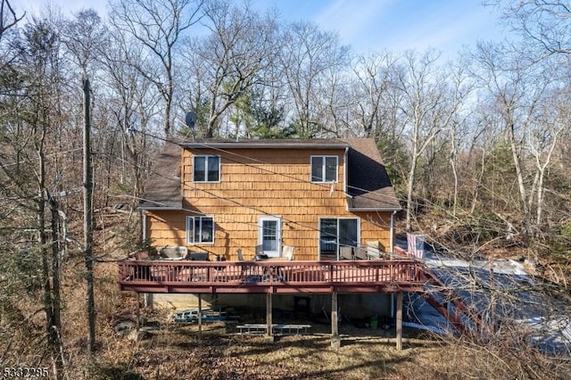 back of property with a deck