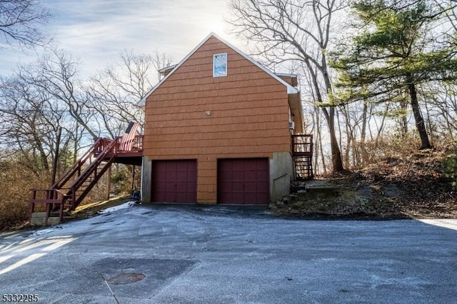 view of side of home featuring a garage