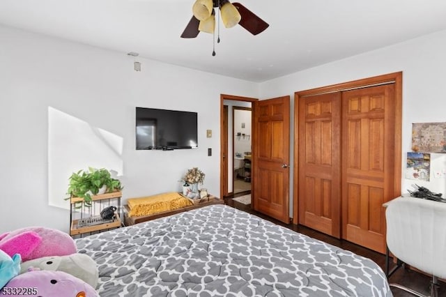 bedroom featuring ceiling fan and a closet