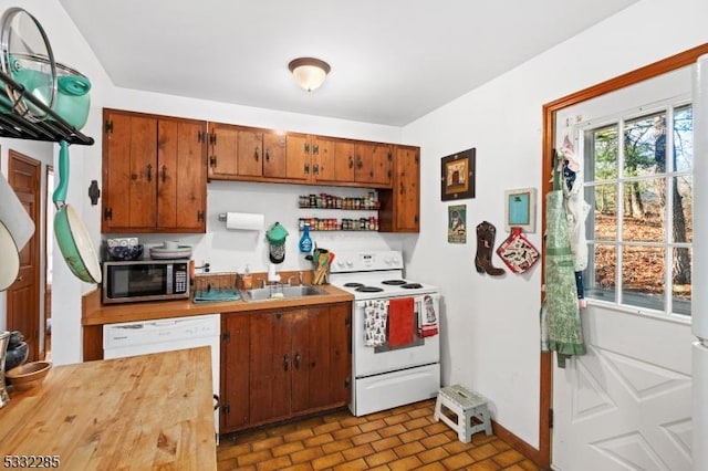 kitchen featuring sink and white appliances