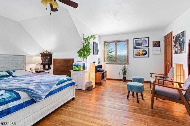 bedroom featuring vaulted ceiling, light hardwood / wood-style flooring, and ceiling fan