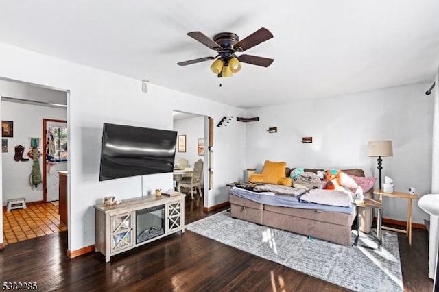 living room with ceiling fan and hardwood / wood-style flooring