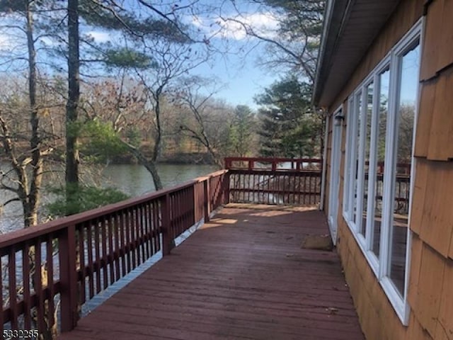 wooden terrace with a water view