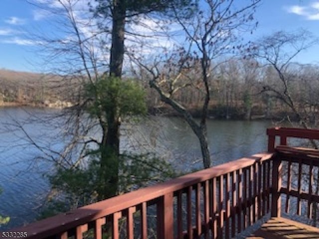 wooden terrace with a water view