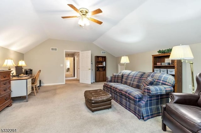 living room with vaulted ceiling, ceiling fan, and carpet