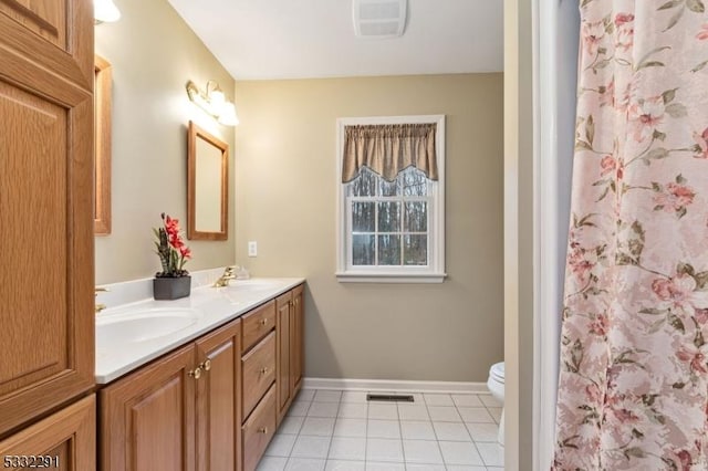 bathroom with toilet, tile patterned floors, a shower with shower curtain, and vanity